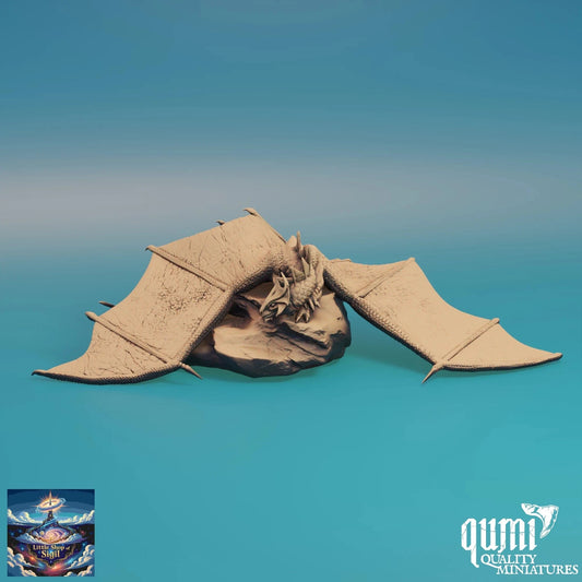 Model of a dragon with open wings on a gradient blue background, featuring the brand 'qumi'.