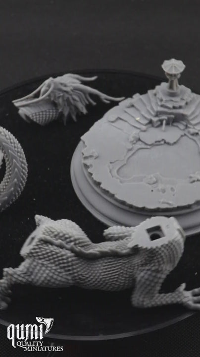 japanese themed dragon printed in parts on a black turning table