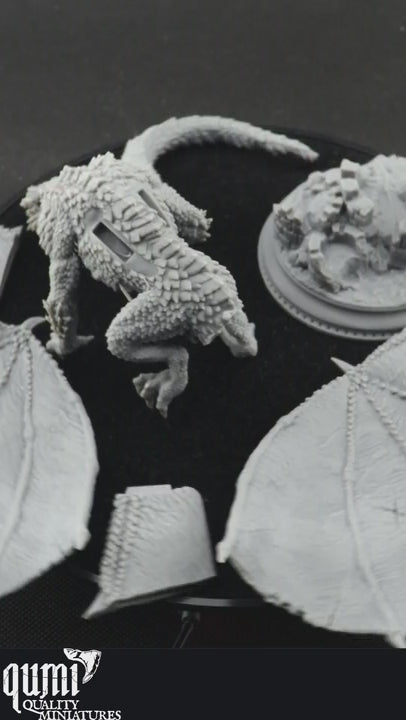 adult silver dragons in parts on a black turning table