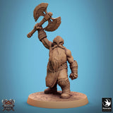 Dwarf warrior miniature captured in a triumphant pose holding his axe aloft, side view.