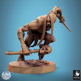 Close-up of a savage undead creature miniature with long hair brandishing a bone weapon, side angle