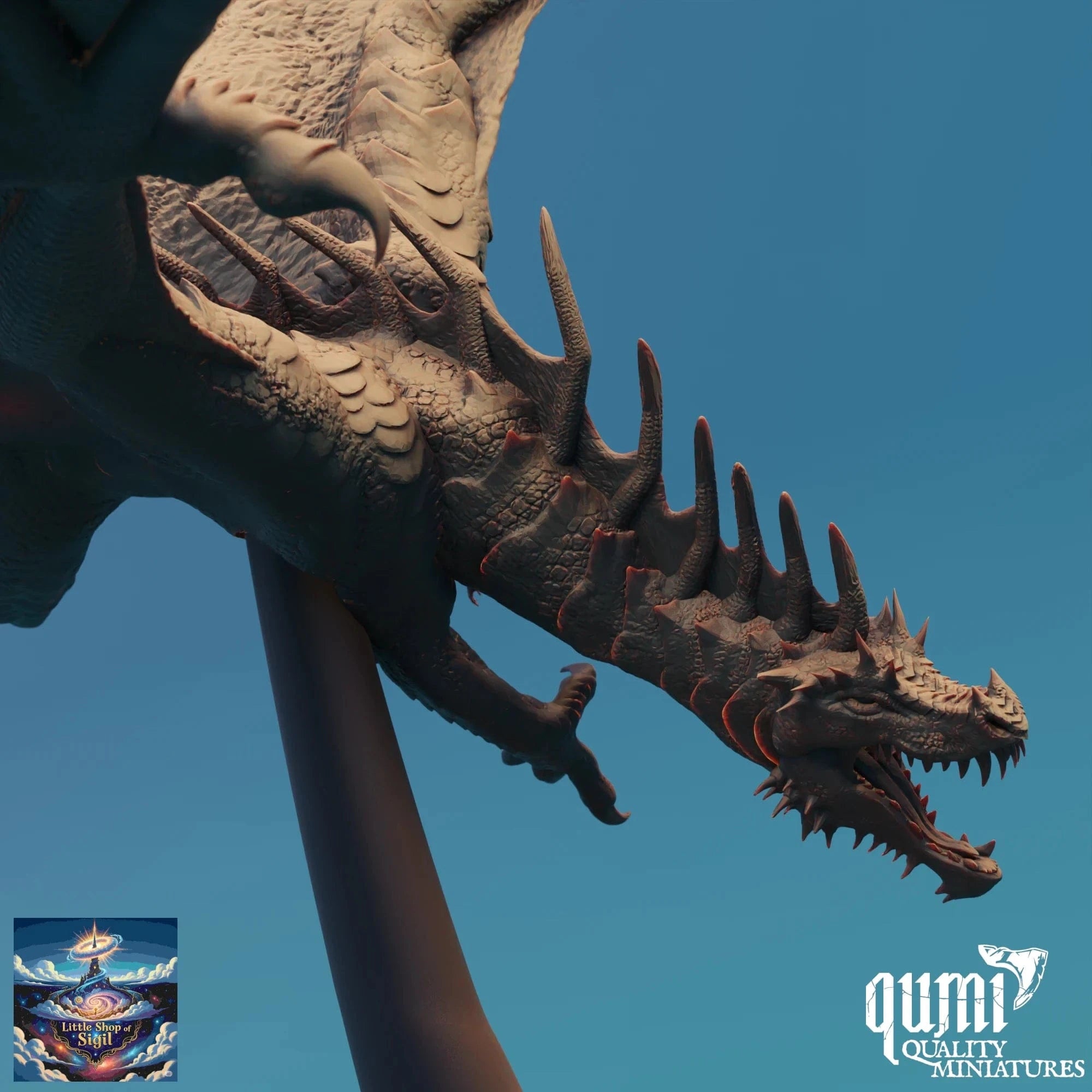 Dragon miniature sculpture on a stand with a clear blue sky background