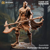 Resin 3D-printed miniature of a female Viking-style Berserker warrior holding a large axe in a forest setting.
