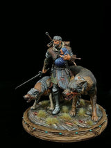 Vollständig bemalte Tabletop-Miniatur eines Kämpfers mit Kind und Wölfen, Seitenansicht.