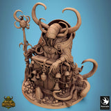 Three-quarter view of the horned monster miniature sitting behind a chained chest on a skull-strewn base.