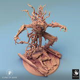 Tree monster miniature, side profile, sitting on a rocky base.