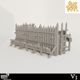 Back view of a wooden wall piece showing the ladder, support beams, and spiked barricade details.