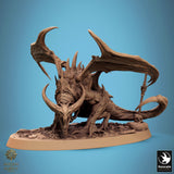 Detailed monster miniature with spiked wings and a sword stuck in a skull base