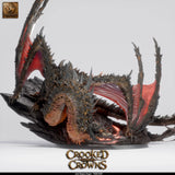 Front view of the Magma Dragon miniature, showcasing its spiky texture, glowing eyes, and rocky base.