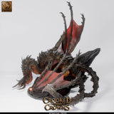 High-angle view of the Magma Dragon miniature displaying the complex, textured pose and base on a clean background.