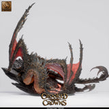 Full profile view of the Magma Dragon standing on a rock base, showcasing its wing span and tail in a neutral setting.