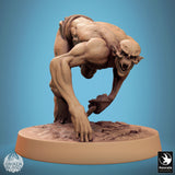 Dynamic pose of a ghoul creature charging forward with a skull-tipped bone weapon.