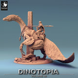 Full side view showing the feathered dinosaur and rider model for tabletop gaming.