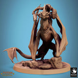 Front view of the Zicoalt miniature with rider, perched on a rocky base.