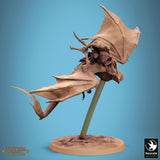 Low-angle side view of the flying Zicoalt dinosaur miniature with a mounted rider.