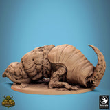 Side profile of the armadillo-like beast showing its plated shell and clawed limbs.