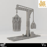 Side profile of the V2 gibbet crane terrain showing the gothic cage and stone counterweight on a wooden base.