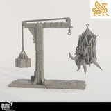 Gray render of a gibbet crane with a stone counterweight and a hanging cage containing a tentacled monster.