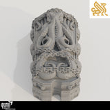 Side profile of the sarcophagus with chains and octopus carvings in a neutral grey finish.