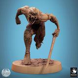 Ghoul warrior with long hair and spiked armor, holding a sword, full body view.