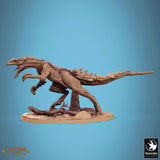 Side profile view of a resin Razoraptor dinosaur model standing on a rocky base with a natural log texture.