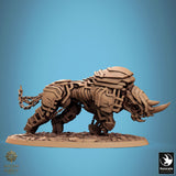 Front view of warrior with horns riding mechanical rhino.