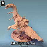 High angle view of the Therizinosaurus miniature on a base with crates and eggs.