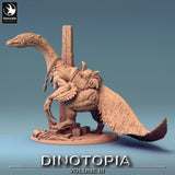 Side profile of a saddled therizinosaurus miniature with long claws and a feathered tail.