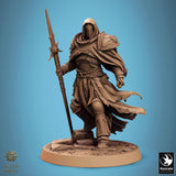 Standing hooded knight miniature holding a long ornate spear, set on a rocky terrain base.