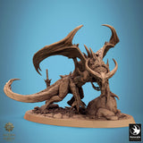 Side profile view of the monster miniature featuring wings and a rocky base