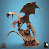 Side profile of the dragon perched on a high rocky pillar with its long tail curved downwards.