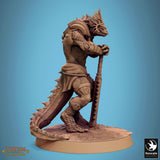 View of reptile warrior with shield and spiked club in a ready stance.