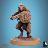 Lizardman miniature with mouth open in a roar, wielding a curved blade in a low combat stance.