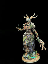 Fully painted Druid miniature standing on a forest-themed base with vibrant mushroom details.