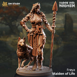 Resin 3D-printed miniature of a female spear fighter standing with a wolf companion on a round base