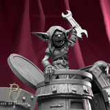 Rear angle of the painted mechanical walker with a goblin reading a book atop the wooden barrel chassis.