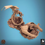 High angle view of dragon diorama showing wings and textured stone base.