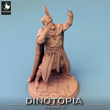 Slightly overhead perspective of the male fantasy character miniature showing the textured base and cloak details.