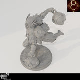 High angle view of the Wind Defender miniature, showing hooded cloak, feather details and spherical canisters.