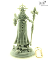Grey resin print of the cleric miniature standing next to a paperclip for scale reference.