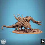 Full side view of the skeletal dragon wyvern miniature standing on a graveyard base with ruined pillars.