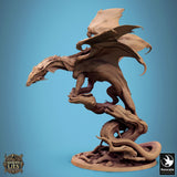 Side profile view of the unpainted green dragon miniature posed on its base