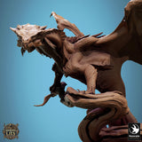 Close-up of the dragon miniature head and upper body, showing intricate scale detail and horns.