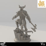 Back view of the armored demon miniature, showing a thick tail, spiked shoulder pads, and rocky terrain base.