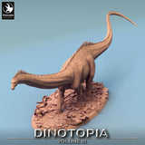 High angle view of the Diplodocus showing its long tail and posture on the scenic rubble base.