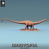Side profile of the long-necked Diplodocus dinosaur model mounted on an oval display base.