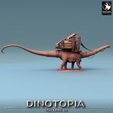 Side profile of a large Diplodocus dinosaur miniature with an ornate merchant caravan platform mounted on its back.