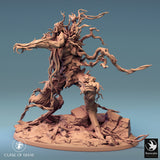 Full side profile of a detailed, unpainted 3D-printed resin Dryad miniature posed on a rocky terrain base