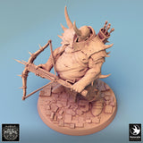High-angle shot of a heavy executioner miniature aiming a spiked crossbow while standing on a rubble base.