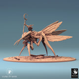 Full side view of the insectoid creature with rider against a blue background